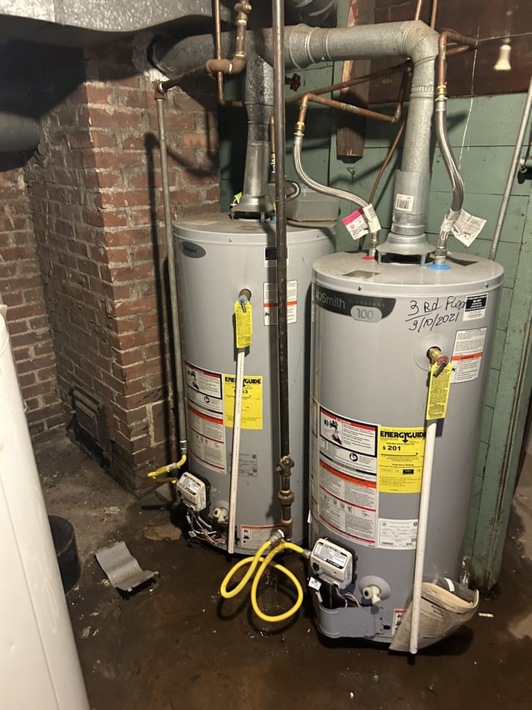 Side-by-side residential gas water heater installation in New Britain CT by Charter Oak Plumbing